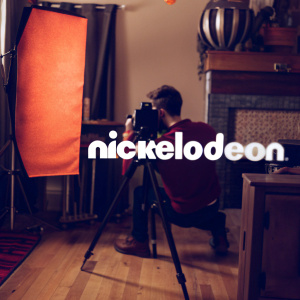Stylized Nickelodeon logo featuring a dynamic abstract shape in orange to the left of the brand name. Set against a clean white backdrop, the design is modern and minimalistic, with bold typography as the focal point.