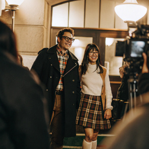 Johnny Knoxville and Naomi Nelson at the TCL Chinese Theatre premiere of 'The Wedding Ringer'. Johnny wears black coat, plaid shirt, glasses. Naomi in white top, plaid skirt.