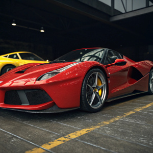 A sleek, red Ferrari LaFerrari, with glossy finish and distinctive emblem, stands out against a dark backdrop. A yellow sports car in the background. Detailed 3D render showcasing aerodynamic design and intricate textures.