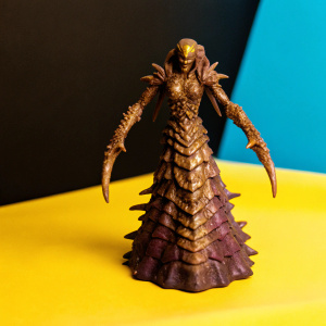 Zagara, StarCraft's fearsome Queen of the Zerg, standing tall with her body covered in a pattern of brown, purple, and gold. Her form is a grotesque amalgamation of spiky, writhing appendages. Dark grey backdrop