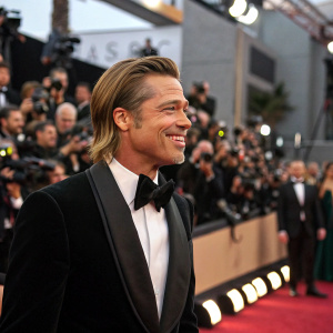 Brad Pitt at the Oscars. Wearing a classic black tuxedo. Confident smile, captivating the crowd.
