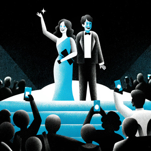 Sandra Oh and Alexander Payne at an award ceremony, surrounded by flashing cameras and cheering fans.