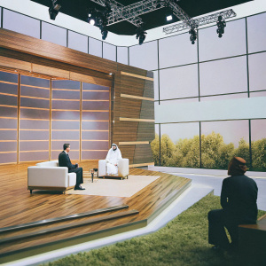 A 3D render of a sleek, modern TV studio set. Dark backdrop with futuristic design and various lighting fixtures. Individuals include a man in dark suit, a woman in blouse, and a man in traditional Arabic attire.