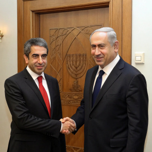 Benjamin Netanyahu and Rosen Plevneliev exchange handshakes. They wear dark suits. Netanyahu in red tie, Plevneliev in black tie. Behind them, a wooden door with intricate lines. This is the focal point of the image.
