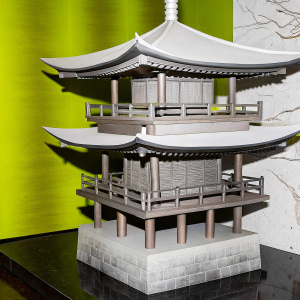 3D model of a traditional Japanese pagoda. Curved roofs, wooden railings. Rendered in pastel tones. Stone base with supporting pillars.