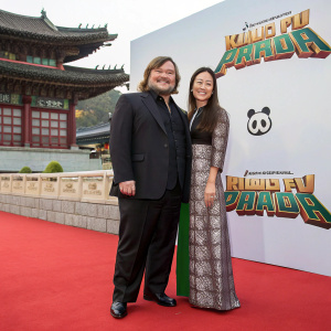 Jack Black and Jennifer Yuh attending Kung Fu Panda 3 premiere in Seoul. Traditional Korean architecture and panda logo visible in background