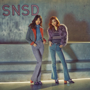 Korean girl group SNSD members Seohyun and Tiffany posing in a sleek studio. Bright, modern backdrop with bold text in English.