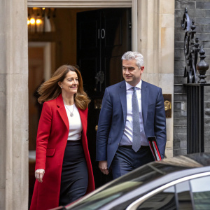 Gillian Keegan and Steve Barclay exiting 10 Downing Street. Gillian smiles warmly, Steve looks serious. Stone facade of the building.