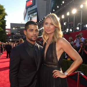 Wilmer Valderrama and Maria Sharapova at the ESPY Awards. Red carpet event, flashing lights, crowd in the background.