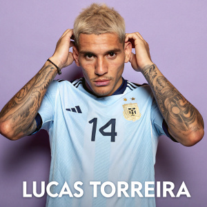 Lucas Torreira, intense gaze, blonde hair, multiple tattoos. Light blue jersey with number 14. Argentina emblem. Close-up portrait, plain purple background.