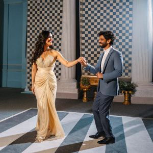Katrina Kaif and Raagjeet Garg at the L'Oreal Paris India launch event. Luxurious stage setup with checkered wall backdrop