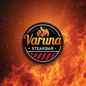 Circular logo design featuring the name Varuna Steakbar in stylized font. Fiery orange and red background.