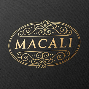 The luxury brand Macali showcases a logo redesign. A sleek, oval shape encapsulates an opulent, handcrafted script.