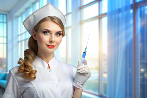 Beautiful Russian nurse in the hospital with a syringe