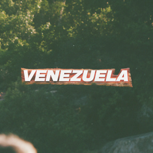 A rough emblem with bold, fiery script 'VENEZUELA' at its center. Depicts Venezuela's authenticity in a rugged, distressed design with mottled grays. The strong, unyielding symbol of Venezuelan craftsmanship set against a plain, unblemished canvas.