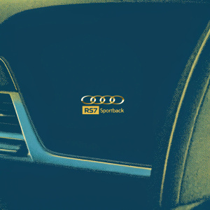 Close-up shot of the luxurious interior of the Audi RS7 Sportback. Premium dashboard with the Audi logo prominently displayed. Special discount offer highlighted. Styling elements showcased.