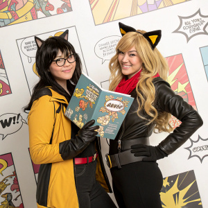 Blake Belladonna and Yang Xiao Long from RWBY. Studio shot. Background with various comic book elements.