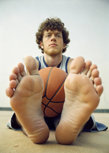 Jack Harlow, sitting, basketball player, showing feet soles to the camera,  close-up on the feet, pits, showing armpits, summer 