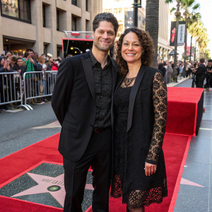 Tom Kitt and Rita Pietropinto at the Hollywood Walk of Fame unveiling ceremony. Both dressed in formal attire with lace overlays and black jackets.