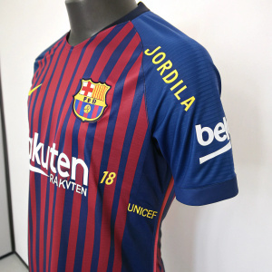 FC Barcelona's jersey showcase featuring Jordi Alba's number 18. Blue and red stripes with Rakuten, Nike, and Unicef logos. Mannequin display with plain white background.