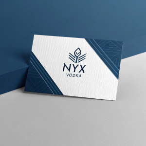 Custom business cards for luxury spirits brand NYX Vodka. Modern logo design in white and navy blue. Sleek, contemporary look