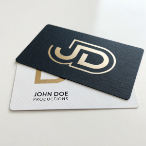 Business cards for John Doe Productions. Modern monogram logo, stylized JD initials on sleek background. Clear contact info: phone, email, website. Professional and concise design.