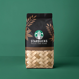 A digital illustration showcasing the sleek design of Starbucks Kailua Kona Blend coffee packaging. The packaging features black and brown elements, including a woven texture that resembles wood. The Starbucks logo and branding elements are prominently displayed against a green backdrop.