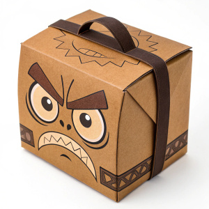 A 3D model of a brown cardboard box designed to resemble an angry cartoon face. The box has a dark brown strap and detailed angry features.