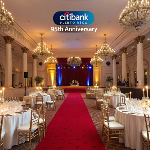 Digital invitation for Citibank Puerto Rico's 95th Anniversary celebration. Lavish ballroom setting. Reserved table highlighted.
