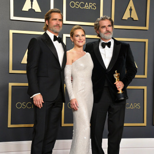 Brad Pitt, Joaquin Phoenix, and Renée Zellweger at the 92nd Annual Academy Awards. Formal attire. Oscars stage, red carpet, Hollywood sign backdrop.