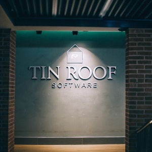Modern logo design for Tin Roof Software. Green and gray palette, sleek lettering. Minimalist backdrop, professional appearance.