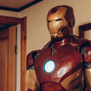 3D render of Tony Stark's Iron Man armor, glossy red and gold, intricate design, detailed face and chest arc reactor, sleek back structure, modern look