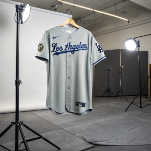 Gray LA Dodgers jersey on an indoor studio set. No background. Product shot highlighting 'Los Angeles' script