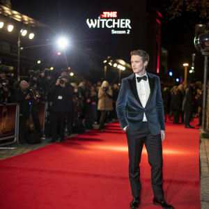 Chris Fulton at the Berlin International Film Festival premiere of 'The Witcher: Season 2'. Formally dressed. Spotlight and red carpet scene.
