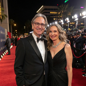 Robert Carradine and Edie Mani at the premiere of Sketch Artist. Wearing formal attire, red carpet event