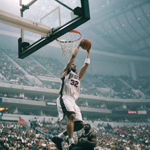Blake Griffin, wearing number 32 jersey, dunks the ball during a high-energy NBA game. The crowd roars in the background.