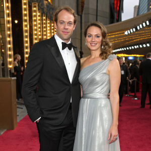 Alun Wyn Jones and Anwen Jones at the glitzy Hollywood Awards. Alun in a sleek black tuxedo, Anwen in a flowing silver gown.