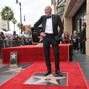 Sir Patrick Stewart at the Hollywood Walk of Fame ceremony. Dressed in a black suit and bow tie.