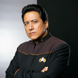 Robert Beltran, stern expression, plain dark background, Star Trek: Voyager cast