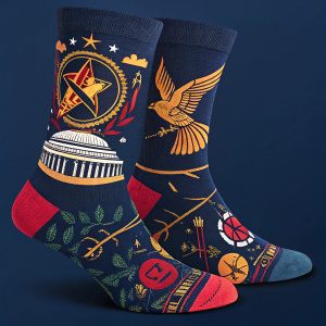 Close-up image of Hunger Games inspired socks. Navy blue background