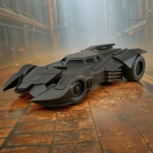 Advanced Batmobile concept art. Black, sleek design with sharp edges, fins and wing-like features. Futuristic cityscape background.