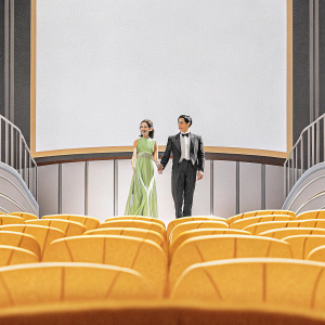 Lee Yeon-Hee and Taecyeon at a glamorous premiere. Both smiling, she in a flowing green gown, he in a black tuxedo. Crowded theater backdrop