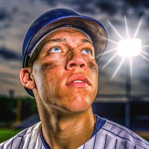 Aaron Judge, baseball player, intense focus. Dark background, spotlight on face
