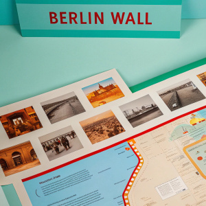Infographic detailing Berlin Wall history. Featuring map of Berlin, historical photographs, and textual descriptions. Grayscale images on neutral background, educational style design.