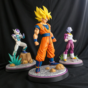 A colorful collection of Dragon Ball Z figurines. Goku and Frieza in action-packed poses. Displayed against a black backdrop.