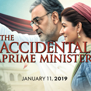 Banner for 'The Accidental Prime Minister' movie. Featuring Anushka Sharma and Ajay Devgn. January 11, 2019 release date. Silver screen premiere