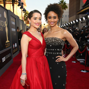 Emilia Clarke and Nathalie Emmanuel attending a glamorous Hollywood awards ceremony.