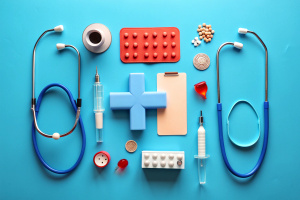 Flat lay composition with medical objects on color background