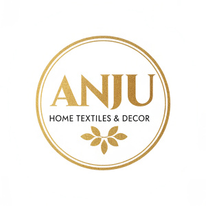 ANJU logo design featuring the brand name 'ANJU' in a bold, elegant, and modern gold-colored font. Below it, 'HOME TEXTILES & DECOR' in a matching style. The entire logo is set against a clean, white background.