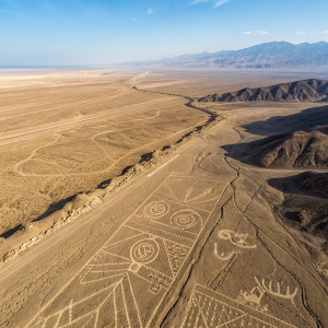 Aerial view of intricate desert drawings in Peru, known as Nazca Lines.